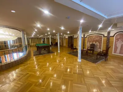 a room with a ping pong table and chairs at nile crouse in Luxor