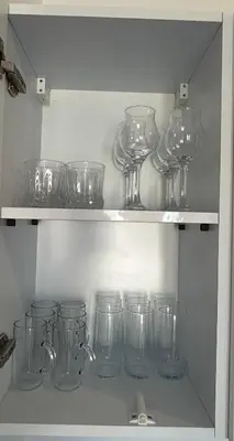 a shelf filled with clear glass jars and bottles at Aqua Infinity Hurghada in Hurghada