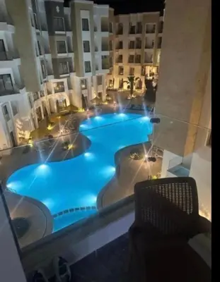 a view of a large swimming pool in a building at Aqua Infinity Hurghada in Hurghada