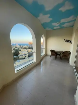 a dining room with a table and a large window at florenza Resort - Hurghada Egypt in Hurghada