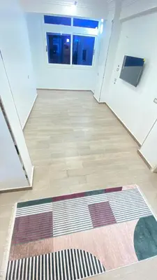 an empty room with a rug on the floor at FUN MBASSY DELUXE APARTMENT ASWAN down town in Aswan