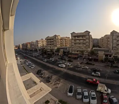 a view of a city with cars parked on a street at Sea La Vie Furnteched, Central, Beach Front, Free WIFI in Hurghada