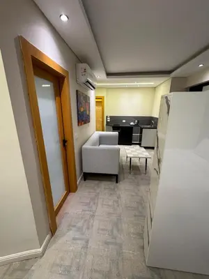 a living room with a couch and a table at CBA - Cavalli Boutique Apartments in Hurghada