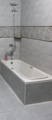 a bath tub in a bathroom with a shower at noreno house in Shellal