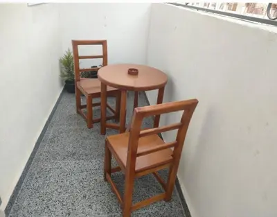 three chairs and a table and a table and chairs at Desert Daisy in Luxor