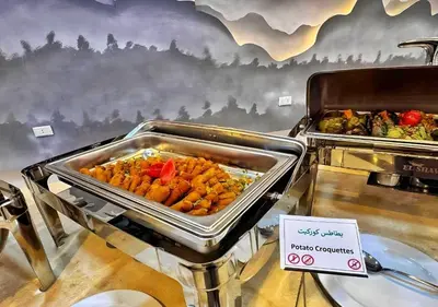 a buffet of food on display in a restaurant at Fanadir Bay Beach Resort & Aqua Park in Hurghada