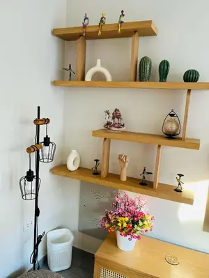 a room with wooden shelves and a table with flowers at 2BR Ground Floor Apartment with Heated Pool in Bali El Gouna in Hurghada
