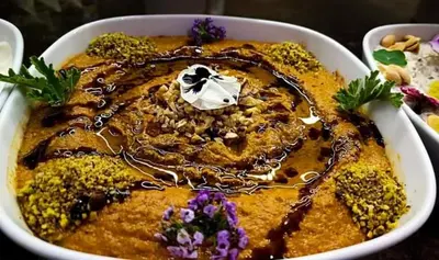 a bowl of food with chocolate and flowers in it at فندق نايل ايليت سوهاج in Qilfāw