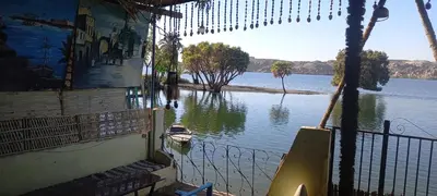 a view of a river with a boat in it at جيست هاوس جبل شيشه سيدون in Maḩaţţat ash Shallāl