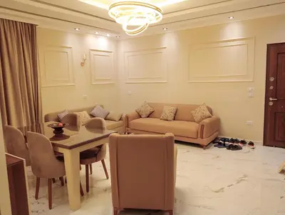 a living room with a couch and a table at Luxury Flat 3 rooms in Hurghada