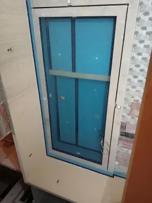 a cabinet with a glass window in a room at Luxury Flat 3 rooms in Hurghada