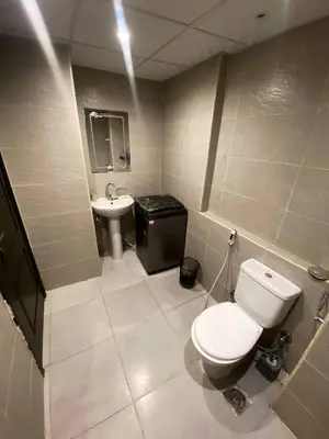 a bathroom with a toilet and a sink at florenza khamsin resort hurghada in Hurghada