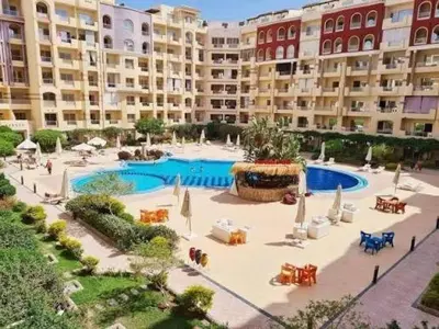 a large apartment complex with a large swimming pool at florenza khamsin resort hurghada in Hurghada