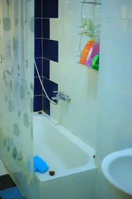 a bathroom with a shower curtain and a sink at Sea Breeze in Hurghada