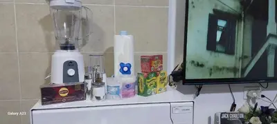 a blender sitting on top of a counter next to a tv at Sea Breeze in Hurghada