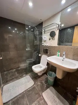 a bathroom with a toilet and a sink and a shower at Ground Floor 1 Bedroom Scrub Unit in El Gouna in Hurghada