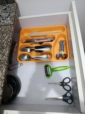 a drawer filled with scissors and other kitchen utensils at Sherathon studio Sheri in Hurghada