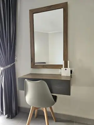 a mirror and a chair in a room at Scandic Resort Hurghada App-C310 in Hurghada
