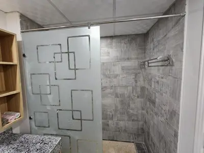 a shower with a glass door in a bathroom at Scandic Resort Hurghada App-C310 in Hurghada