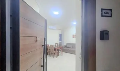 a door leading into a room with a dining room at La Quinta Beach Resort in Hurghada in Hurghada
