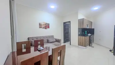 a living room with a couch and a television at La Quinta Beach Resort in Hurghada in Hurghada