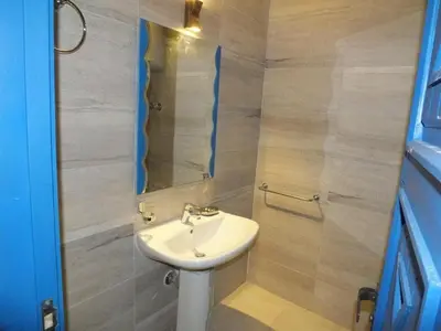 a bathroom with a sink and a mirror at Chalet with private pool in Hurghada