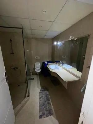 a bathroom with a sink and a toilet at cozy sea view apartment palma resort in Hurghada