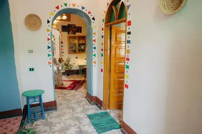 a hallway with an archway in a house at Harmonia House in Al Karnak