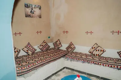 a room with two beds with pillows on them at Harmonia House in Al Karnak