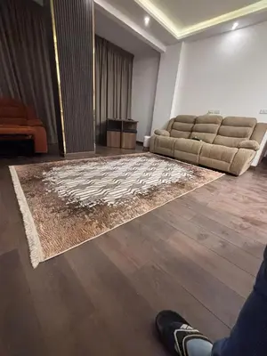 a living room with a couch and a rug at Unique apartment in hurghada in Hurghada