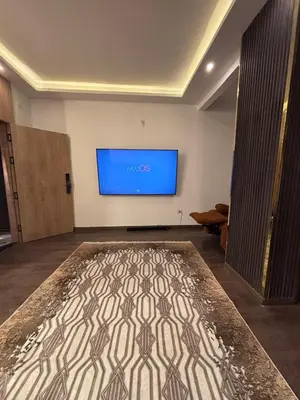 a room with a flat screen tv on the wall at Unique apartment in hurghada in Hurghada