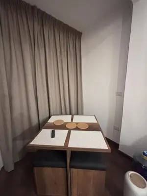 a small table in a room with a table and chairs at Unique apartment in hurghada in Hurghada