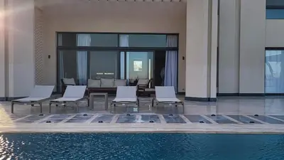 a group of chairs and a pool in a building at Elgouna -4 bedroom villa with private heated pool in Hurghada