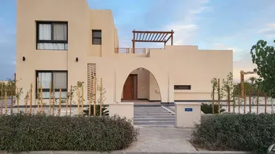 a large building with a staircase in front of it at Elgouna -4 bedroom villa with private heated pool in Hurghada