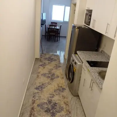 a kitchen with a washer and dryer in a room at Amazing 1 bedroom & sofa bed at Selenabay Hurghada in Hurghada
