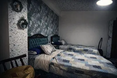 a bedroom with two twin beds in a room at Tiba Golden in Hurghada
