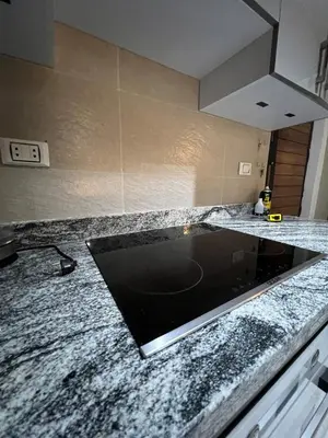 a kitchen counter with a sink in the middle at Luxury Sea-View Rooftop with Private Terrace in Hurghada