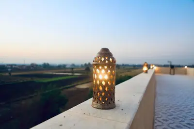 a light on a wall with lights on it at Saray El Omda - Egyptian Rural Village in Luxor