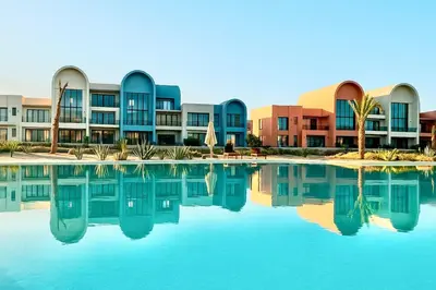 a pool of water in front of a building at The Two Sisters - Kamaran, El Gouna in Hurghada
