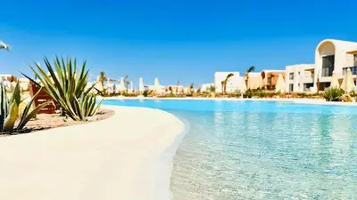 a resort with a swimming pool and some buildings at The Two Sisters - Kamaran, El Gouna in Hurghada