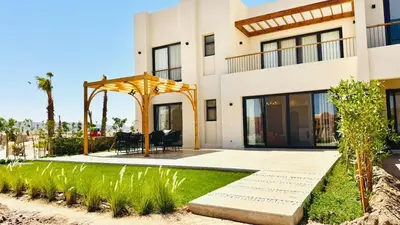 a house with a garden and a patio at The Two Sisters - Kamaran, El Gouna in Hurghada