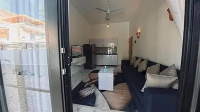 a living room with a couch and a table at Luxor Hermes Guest House in Luxor