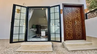 a front door of a home with a glass door at Luxor Hermes Guest House in Luxor
