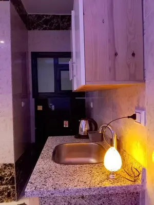 a kitchen with a sink and a lamp on a counter at The Arabic Jewel 2 Bedroom Home plus Sun Roof Terrace in Hurghada