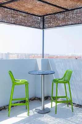 two chairs and a table on a roof at The Arabic Jewel 2 Bedroom Home plus Sun Roof Terrace in Hurghada