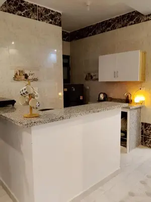 a kitchen with a counter top in a room at The Arabic Jewel 2 Bedroom Home plus Sun Roof Terrace in Hurghada