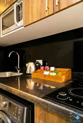 a kitchen counter with a sink and a counter top with a sink at La Quinta Beach Resort Hurghada in Hurghada