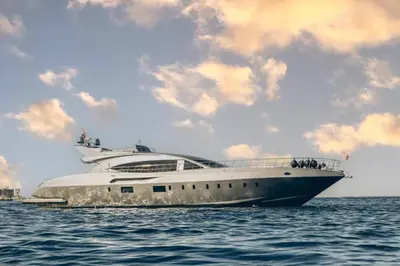 a large white yacht in the water under a cloudy sky at TaiTours in Hurghada