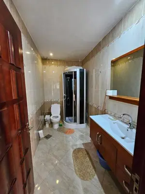 a bathroom with a toilet and a sink and a shower at Sea-View apartment in El Andalous in Hurghada