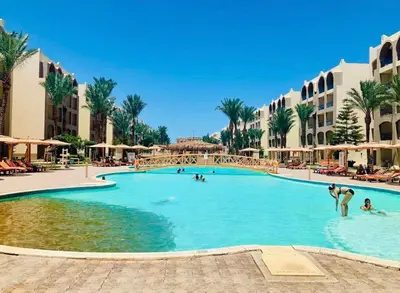 a swimming pool at a resort with people in it at Nobia Aqua Beach in Hurghada